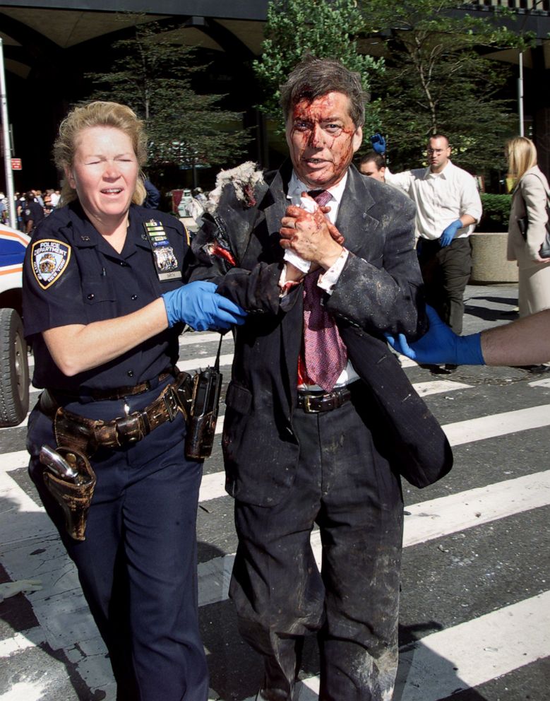 PHOTO: Police Officer Moira Smith helps Edward Nicholls escape from the South Tower of the World Trade Center minutes before its collapse, Sept. 11, 2001. She reentered the building to assist others in the evacuation and was killed.