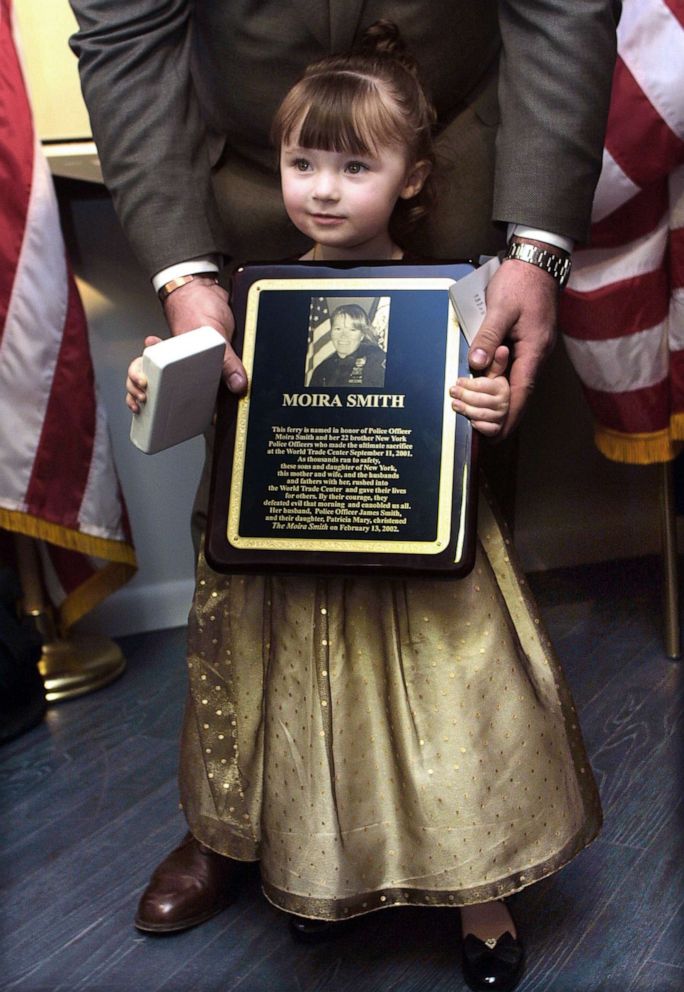 PHOTO: 2-year-old Patricia Mary Smith holds a plaque honoring her deceased mother, New York City Police Officer Moira Smith, during an event in New York City, Feb. 13, 2002, honoring Officer Smith by christening a ferry in her name.