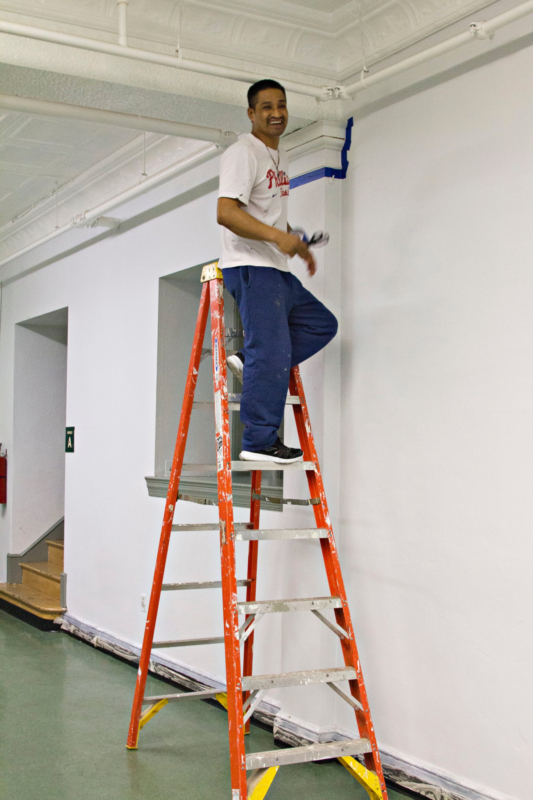 PHOTO: Javier Flores Garcia used to work outdoors as an arborist. Now he does odd jobs around the church, including painting. The church has been supporting Garcia and his family while he is in sanctuary. 