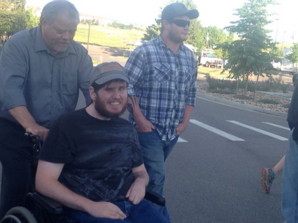 PHOTO: Caleb Medley, who was injured in the Aurora, Colorado, movie theater shooting on July 20, 2012 is pushed by a family member outside the courtroom. The gunman, James Holmes, was convicted of all 165 charges he faced on July 16, 2015.