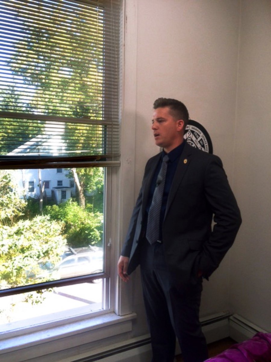 PHOTO: Interim Police Chief in Potsdam, New York, Mark Murray, stands in the house where Phillips' body was found on Sept. 27, 2016. The window is how it is believed that the killer escaped.