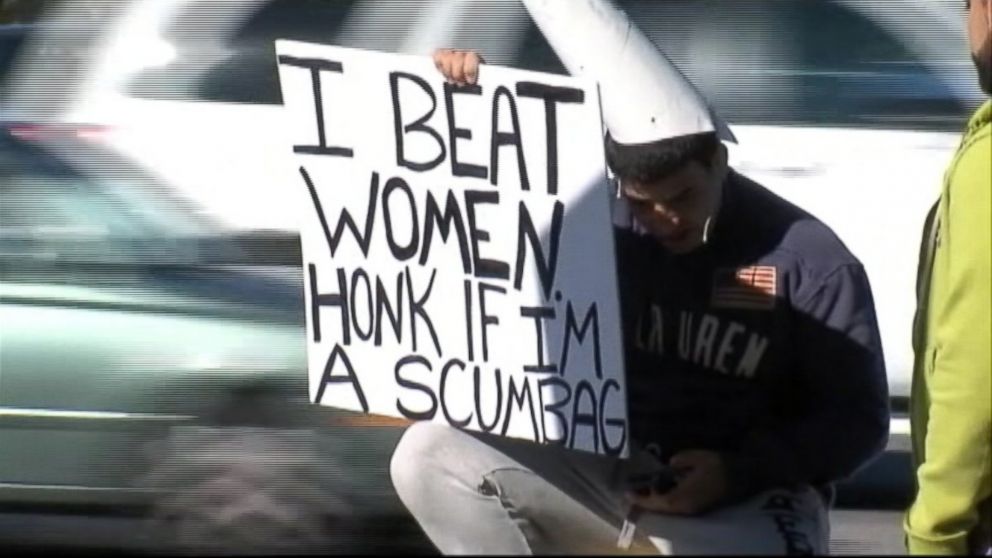 A Tampa, Fla. woman chooses to embarrass her alleged attacker by having him hold a sign that says "I beat women. Honk if I'm a scumbag."