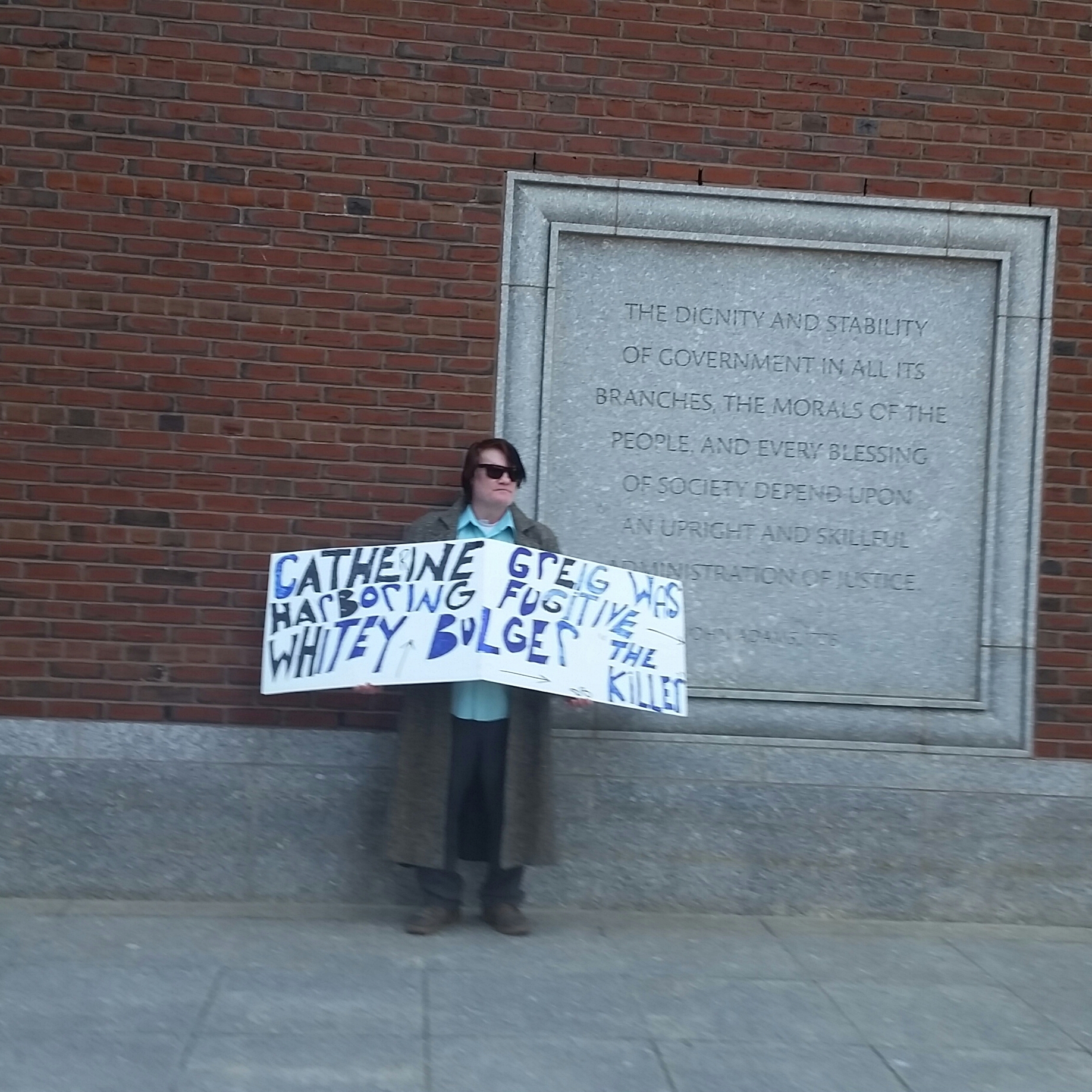 PHOTO: A protester stood outside the courthouse in South Boston , where Whitey Bulger's longtime girlfriend, Catherine Greig, was sentenced to an additional 21 months in prison.