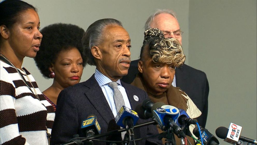 PHOTO: Rev. Al Sharpton, center, speaks about Saturday's killings of two New York City police officers, Dec. 21, 2014 during a news conference at the National Action Network headquarters, in New York. 