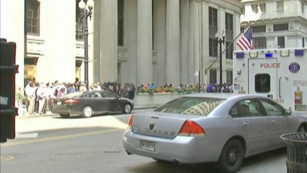 PHOTO: Police vehicles are parked outside of 231 South Lasalle St. in Chicago following a shooting inside the building.