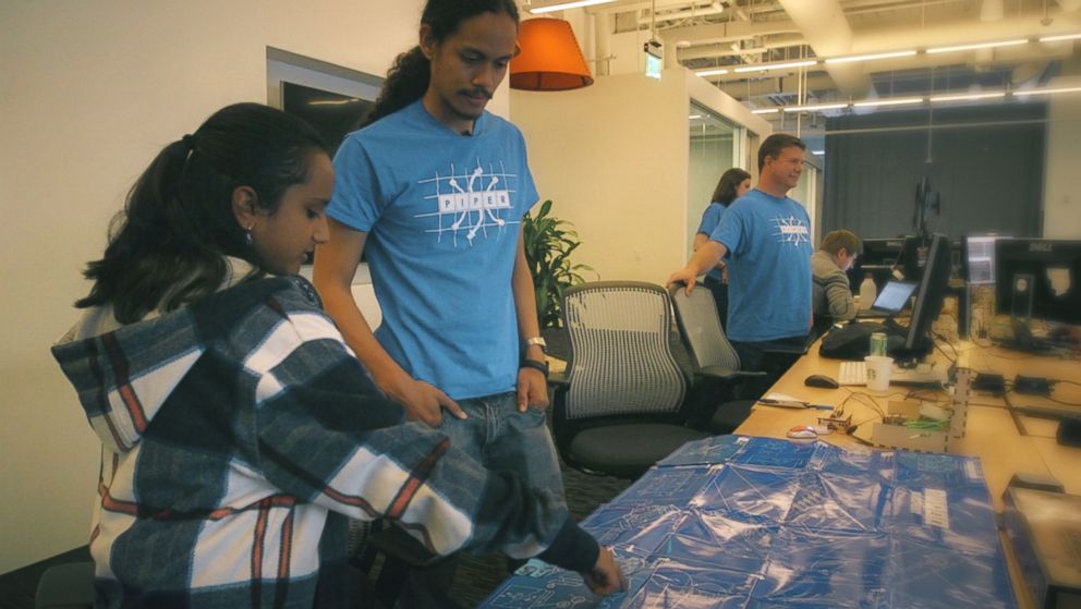 PHOTO: Hari Bhimaraju goes over blueprints at the San Francisco based tech company Piper.