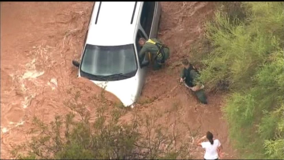 PHOTO: MCSO crews rescue a woman trapped in flood waters.