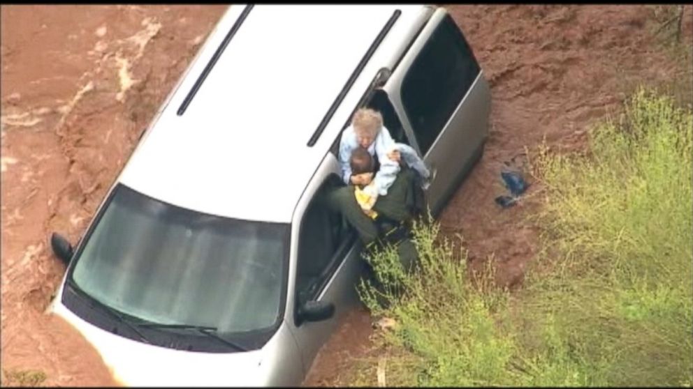 PHOTO: MCSO crews rescue a woman trapped in flood waters.