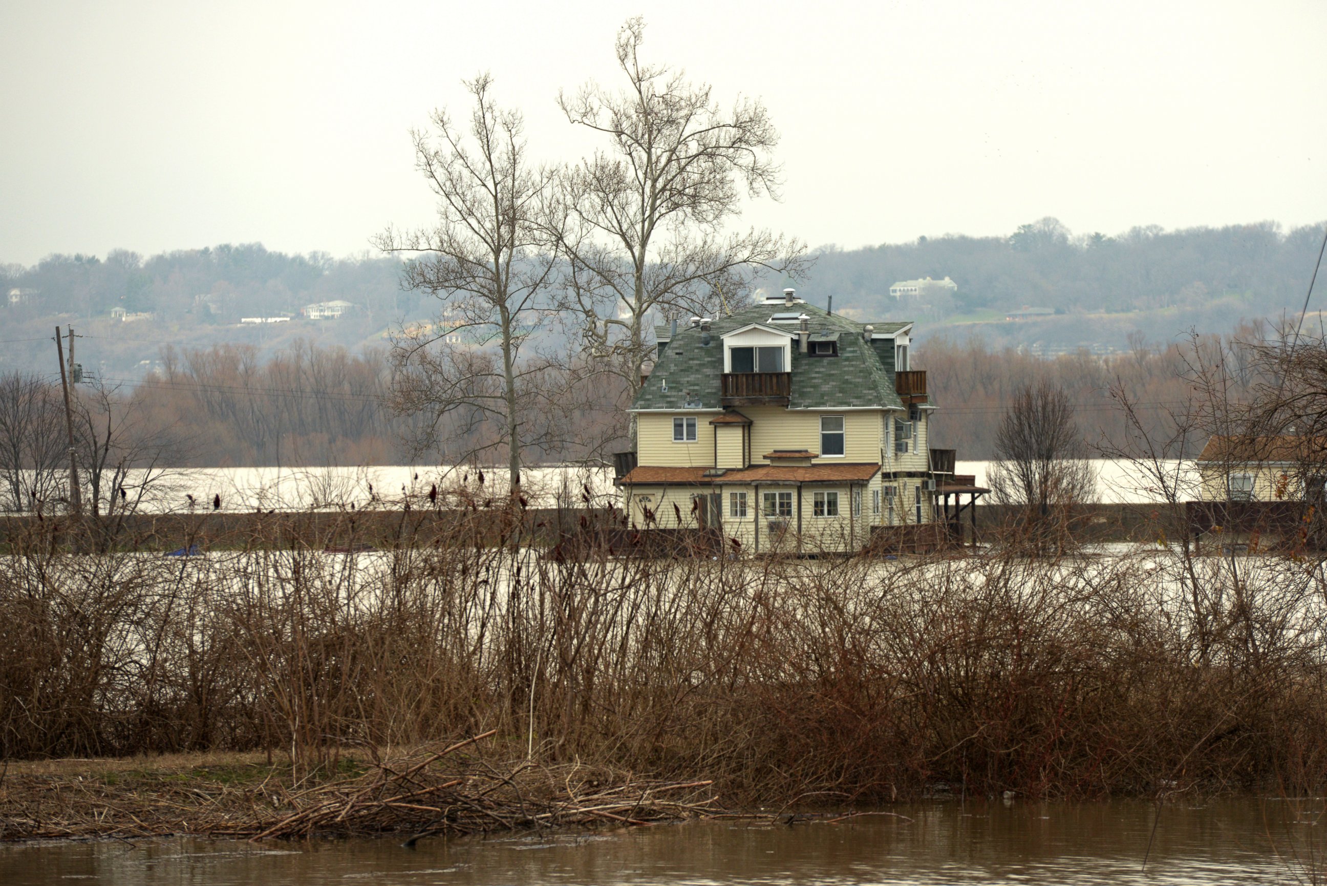 PHOTO: Farmland adjacent to Highway 67 in West Alton remains flooded on Wednesday, Dec. 30, 2015. Residents of West Alton, Mo. evacuated as climbing water threatened exit routes.