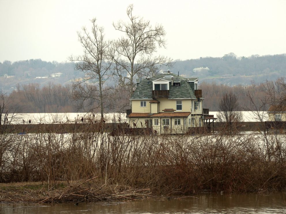 PHOTO: Farmland adjacent to Highway 67 in West Alton remains flooded on Wednesday, Dec. 30, 2015. Residents of West Alton, Mo. evacuated as climbing water threatened exit routes.