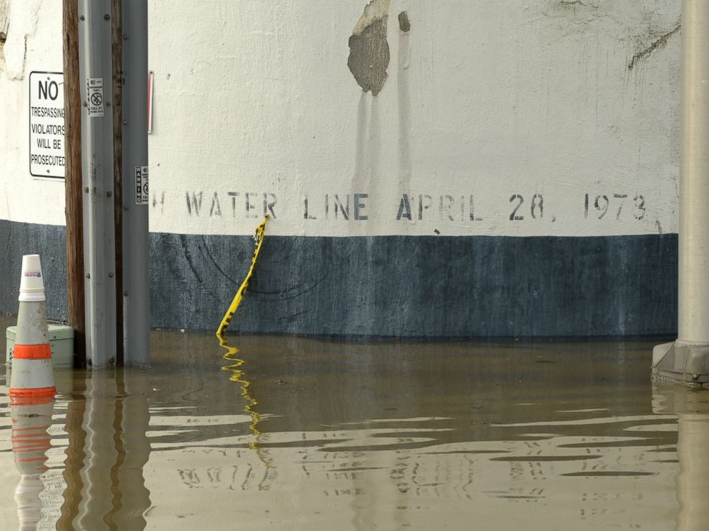 PHOTO: Flood water near the Ardent Mills get close to historic flood level of 1973. The black band on the silo wall indicates the level of water during the April 28, 1973 floods.