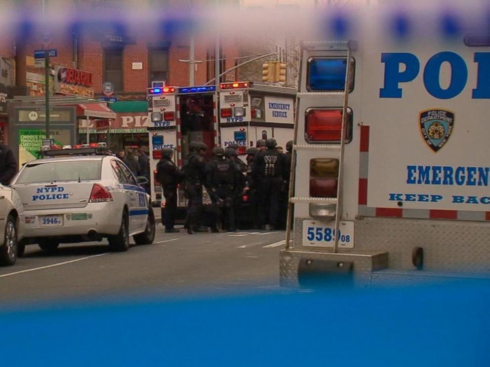 PHOTO: Law enforcement responds after two NYPD cops were shot in their patrol car in Brooklyn, Dec. 20, 2014.