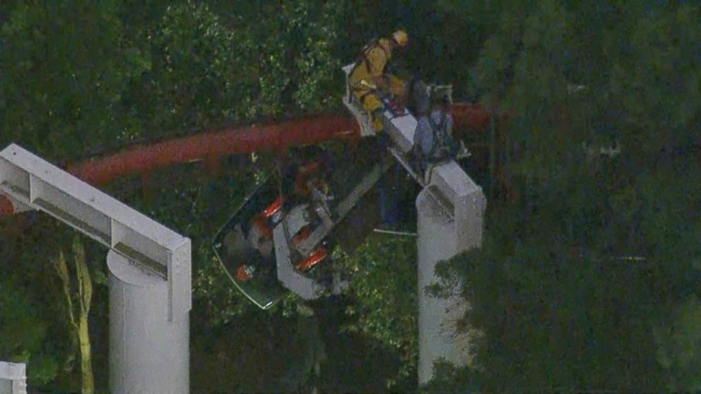 PHOTO: Firefighters and park maintenance workers in harnesses removed the stranded riders one by one.