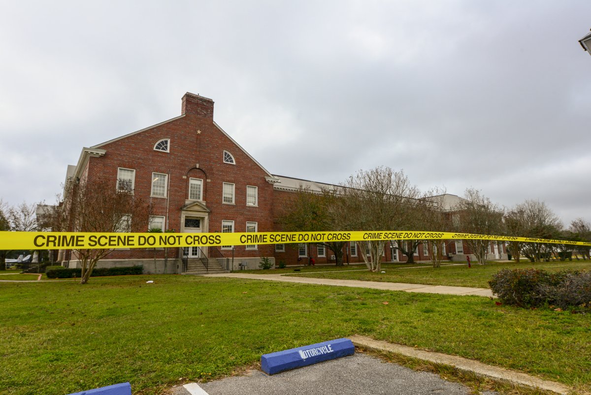 PHOTO: This file handout photo released on December 7, 2019 by the Federal Bureau of Investigation shows police tape stretching across a street near a building after a shooting incident at a naval base in Pensacola, Fla., Dec. 6, 2019. 