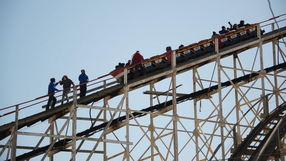 PHOTO: Riders are evacuated from the Cyclone roller coaster in Coney Island, New York City on March 29, 2015.