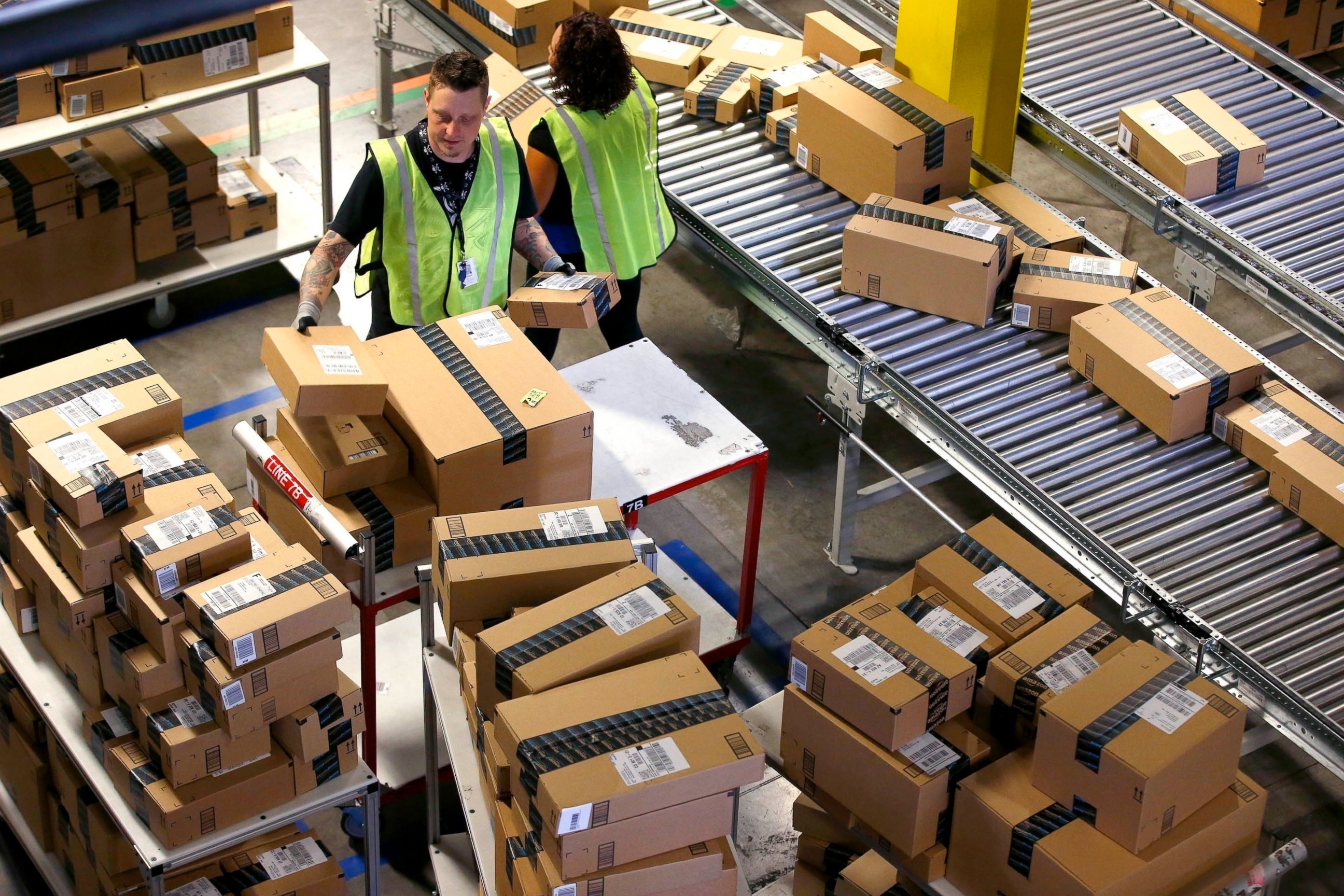 PHOTO: Amazon.com employees organize outbound packages at an Amazon.com Fulfillment Center on "Cyber Monday" the busiest online shopping day of the holiday season, in Phoenix. 