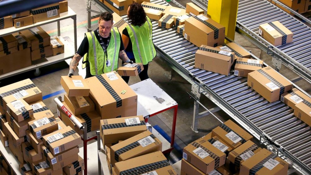 PHOTO: Amazon.com employees organize outbound packages at an Amazon.com Fulfillment Center on "Cyber Monday" the busiest online shopping day of the holiday season, in Phoenix. 