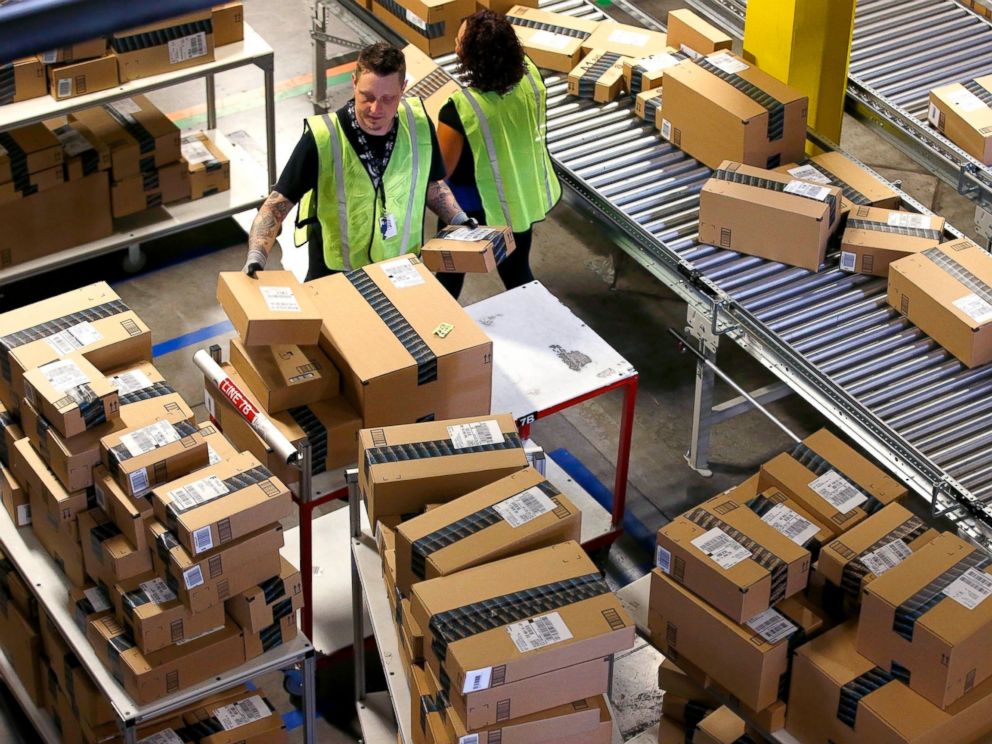 PHOTO: Amazon.com employees organize outbound packages at an Amazon.com Fulfillment Center on Cyber Monday the busiest online shopping day of the holiday season, in Phoenix.