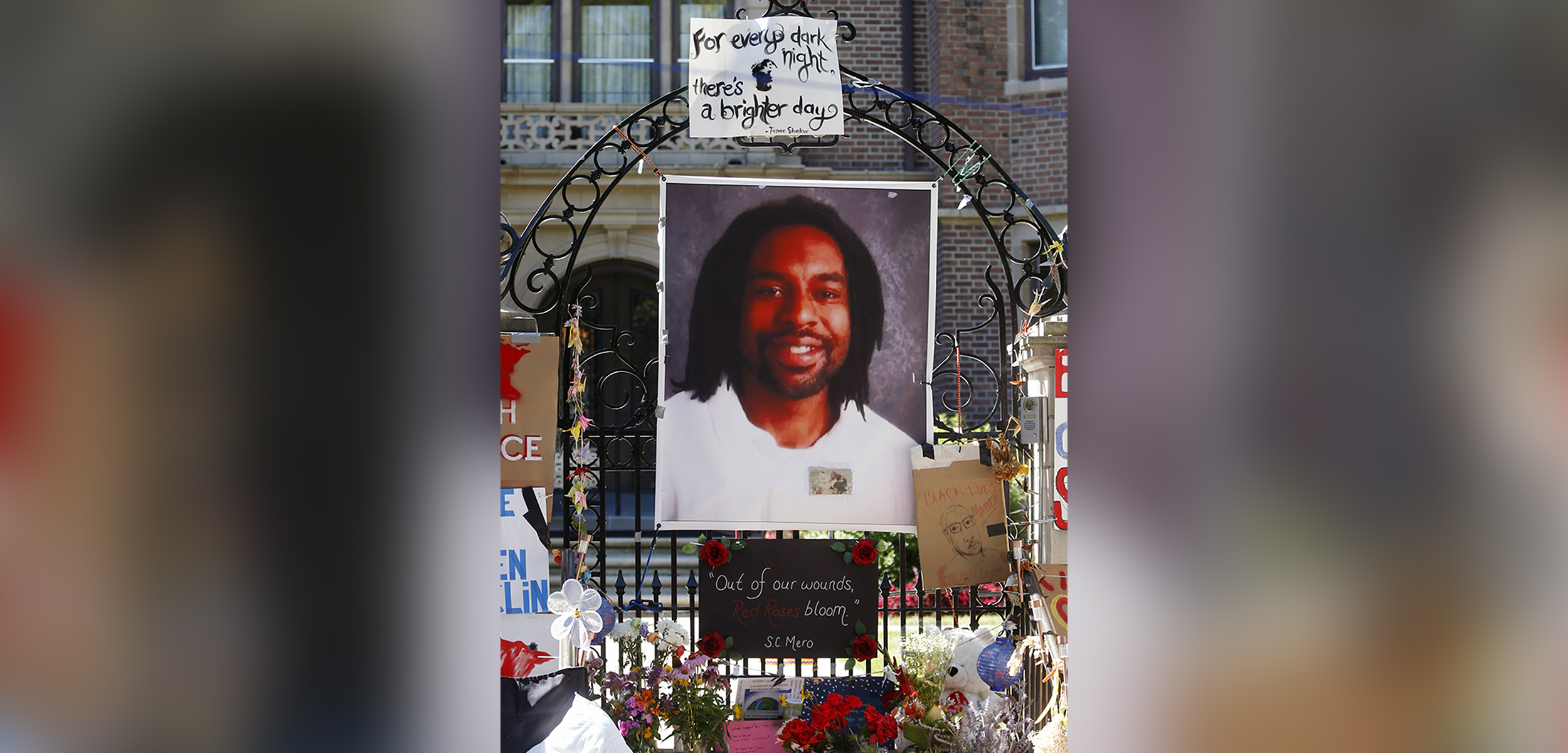 PHOTO: A memorial including a photo of Philando Castile adorns the gate to the governor's residence where protesters continued to demonstrate in July 2016, in St. Paul, Minn.