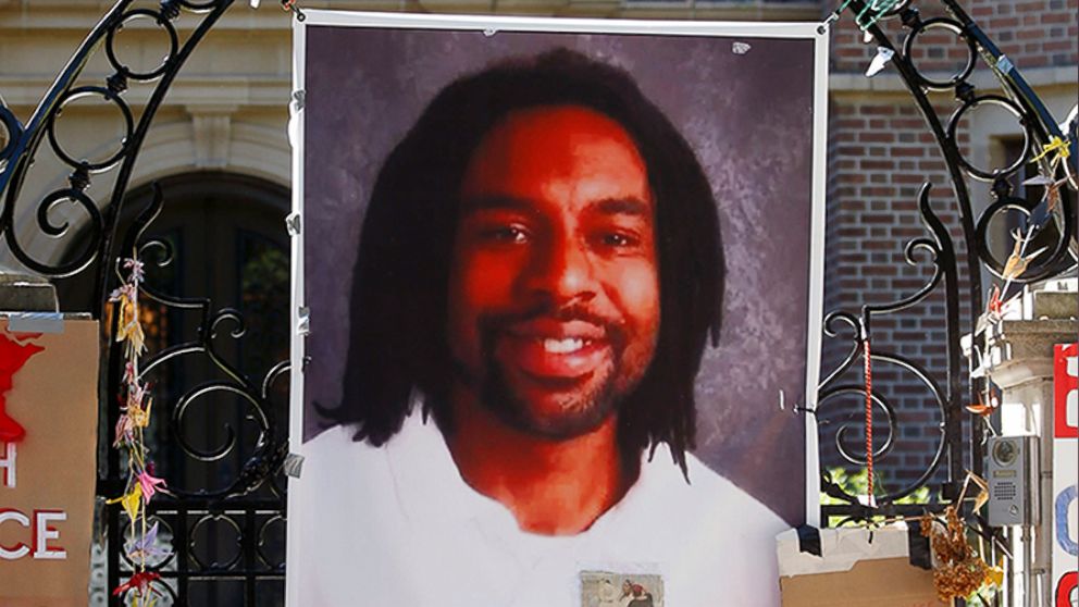 PHOTO: A memorial including a photo of Philando Castile adorns the gate to the governor's residence where protesters continued to demonstrate in July 2016, in St. Paul, Minn.