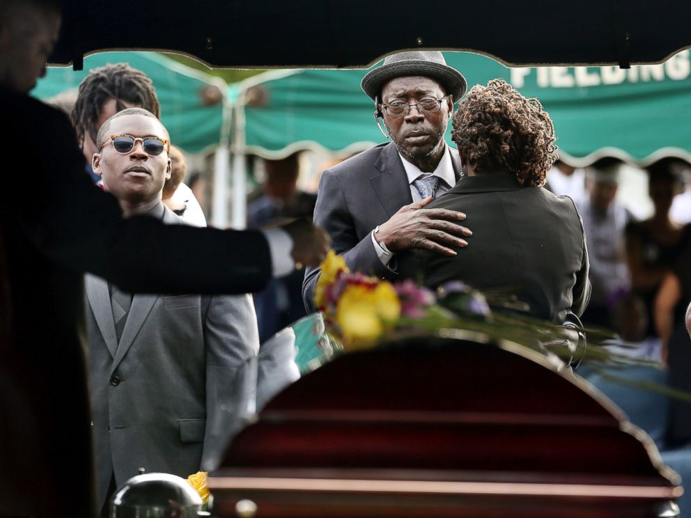 PHOTO: Parents of Tywanza Sanders, Tyrone Sanders and Felicia Sanders comfort each other at the graveside of their son at Emanuel AME Cemetery in Charleston, South Carolina, in this June 27, 2015 file photo. 