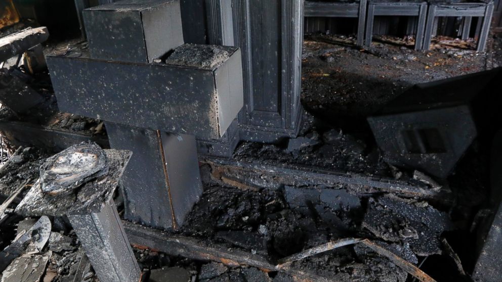 PHOTO: Burned pews, destroyed musical instruments, Bibles and hymnals are part of the debris inside the fire damaged Hopewell M.B. Baptist Church in Greenville, Mississippi, Nov. 2, 2016.