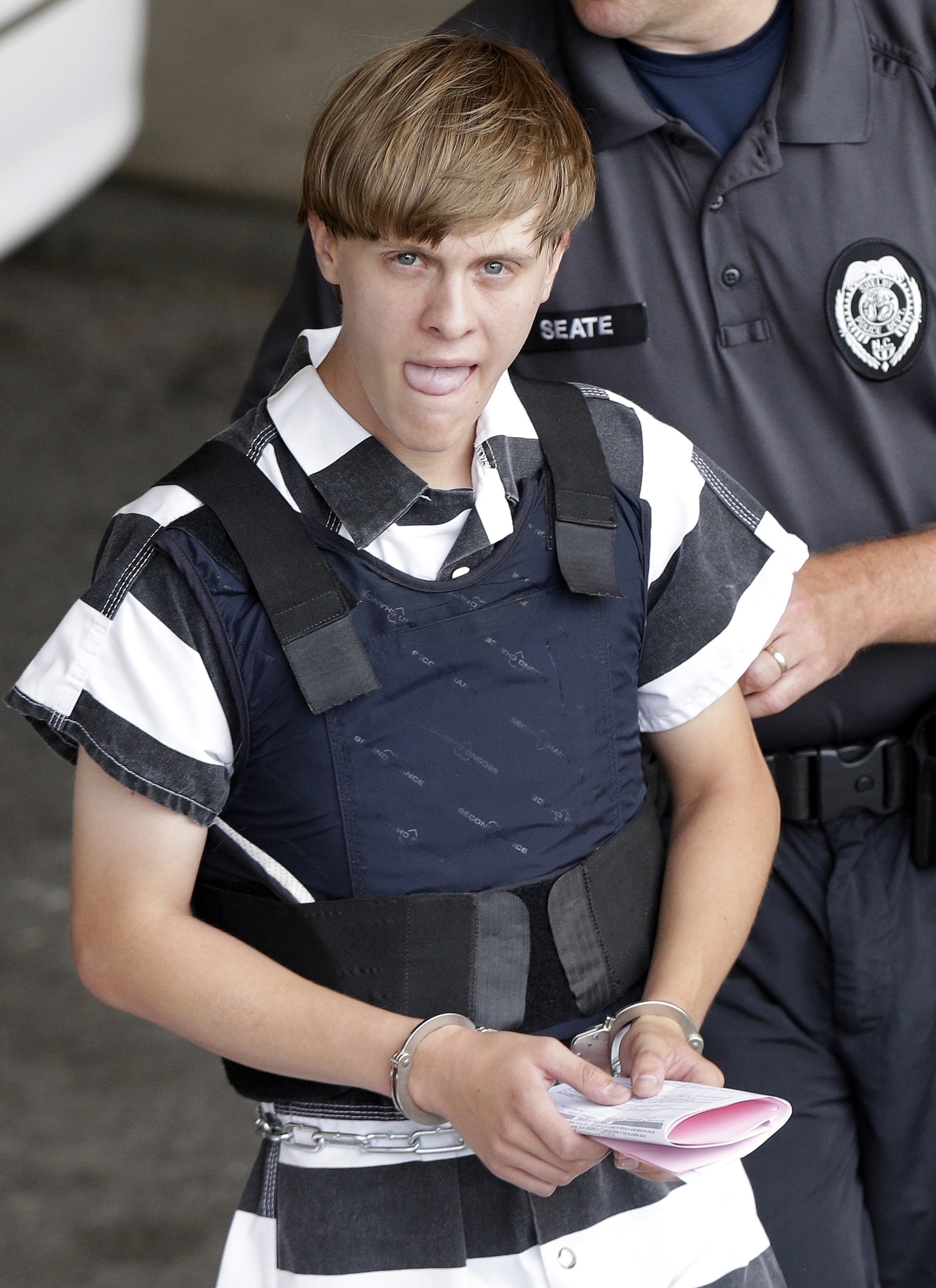 PHOTO: Shooting suspect Dylann Roof is escorted from the Cleveland County Courthouse in Shelby, North Carolina, June 18, 2015.  