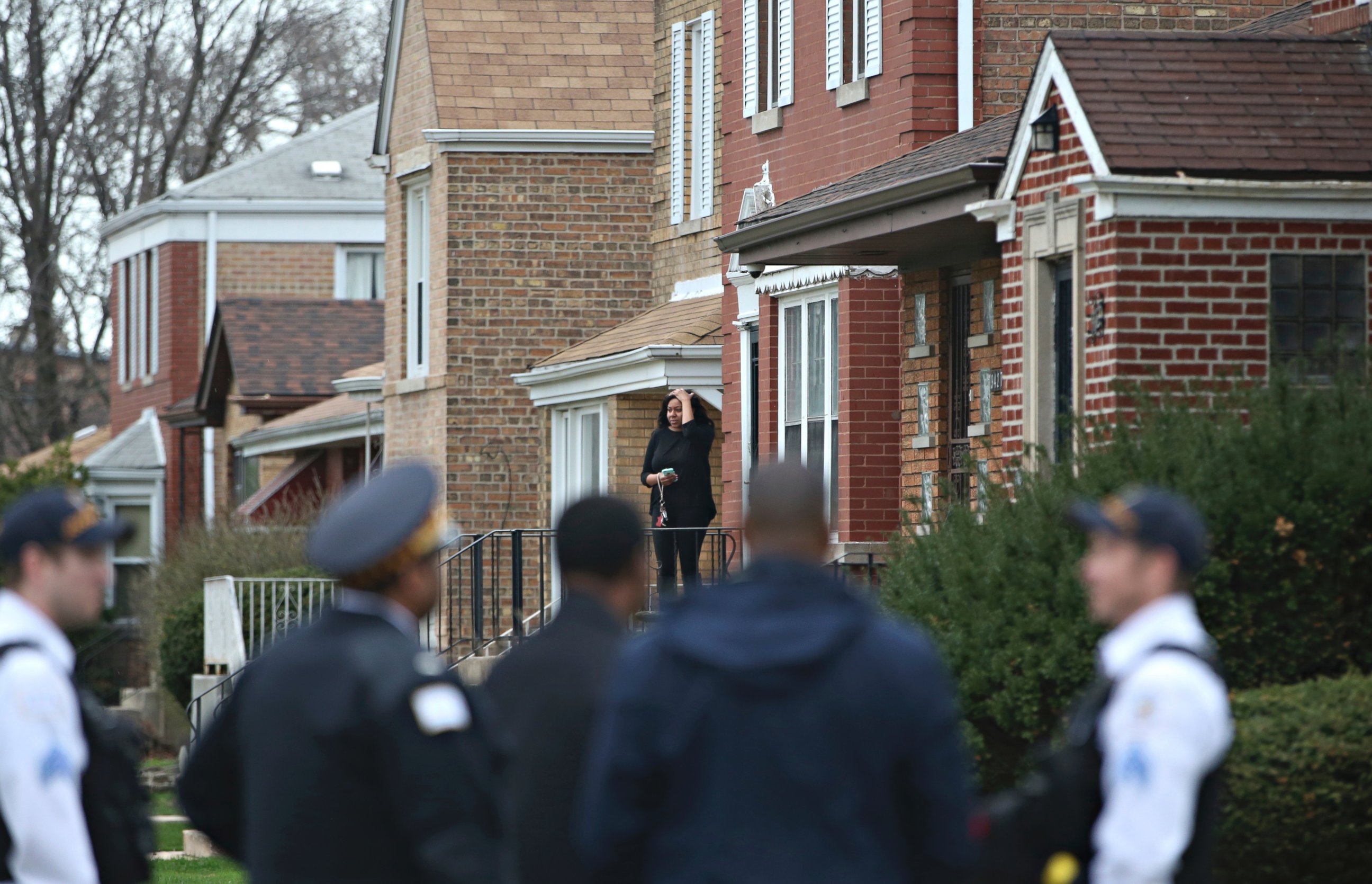 PHOTO: Authorities gather on a residential street on the South Side of Chicago, April 10, 2017, after Cook County Circuit Court Judge Raymond Myles was shot to death outside his home. 