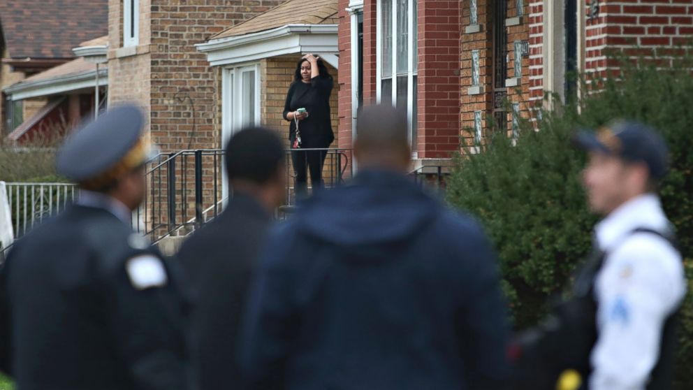 PHOTO: Authorities gather on a residential street on the South Side of Chicago, April 10, 2017, after Cook County Circuit Court Judge Raymond Myles was shot to death outside his home.