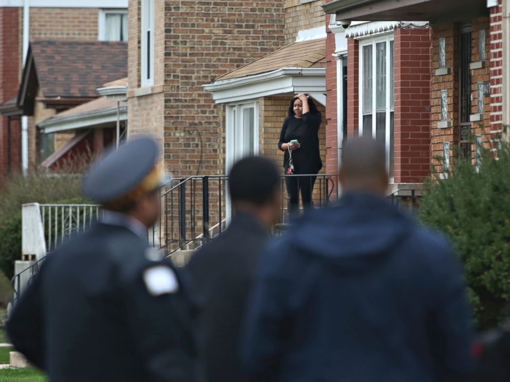 PHOTO: Authorities gather on a residential street on the South Side of Chicago, April 10, 2017, after Cook County Circuit Court Judge Raymond Myles was shot to death outside his home.