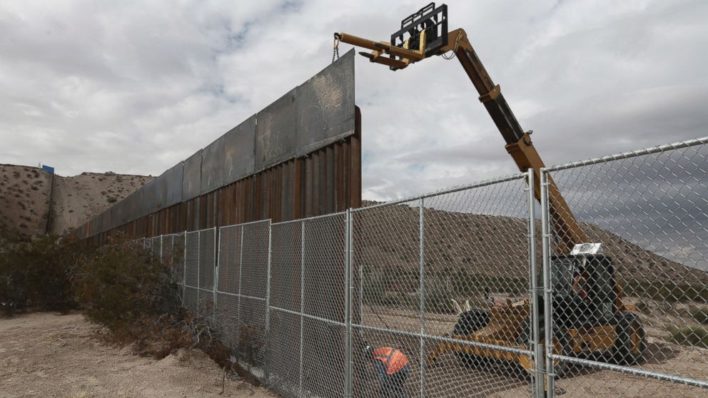 PHOTO: Workers raise a taller fence along the Mexico-U.S. border between the towns of Anapra, Mexico and Sunland Park, New Mexico, Nov. 10, 2016. 