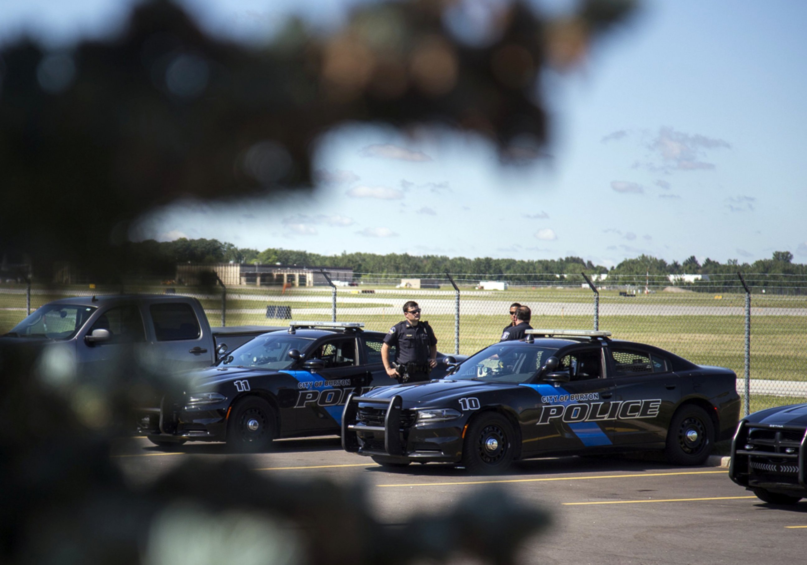 PHOTO: Burton Police Officers gather at Bishop International Airport, June 21, 2017, in Flint, Mich. 