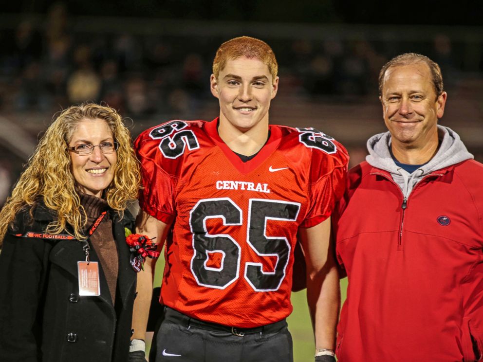 PHOTO: This October 31st 2014 photo by Patrick Carns shows Timothy Piazza, center, with his parents, Evelyn Piazza and James Piazza, during the senior night at Hunterdon Central Regional High School in Flemington, New Jersey. 