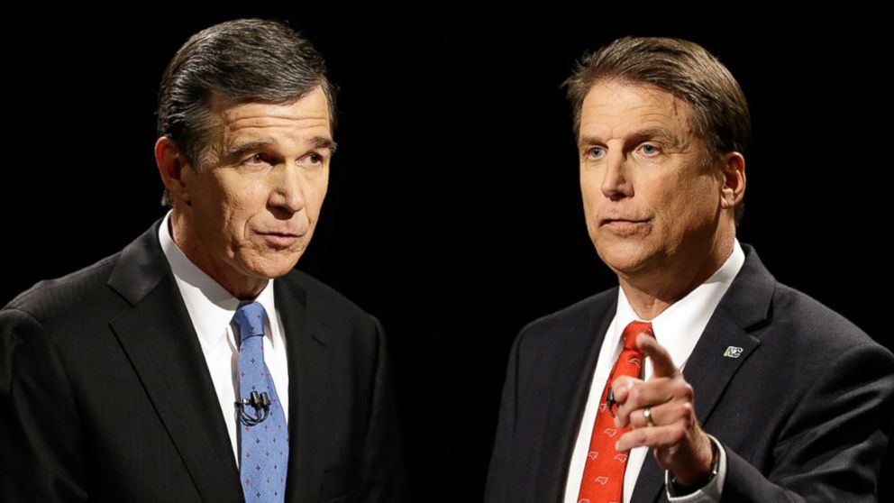 Democratic gubernatorial candidate Attorney General Roy Cooper, shown on the left, participates in a live televised gubernatorial debate with North Carolina Republican Gov. Pat McCrory at UNC-TV studios in Research Triangle Park, North Carolina, Oct. 11, 2016.
