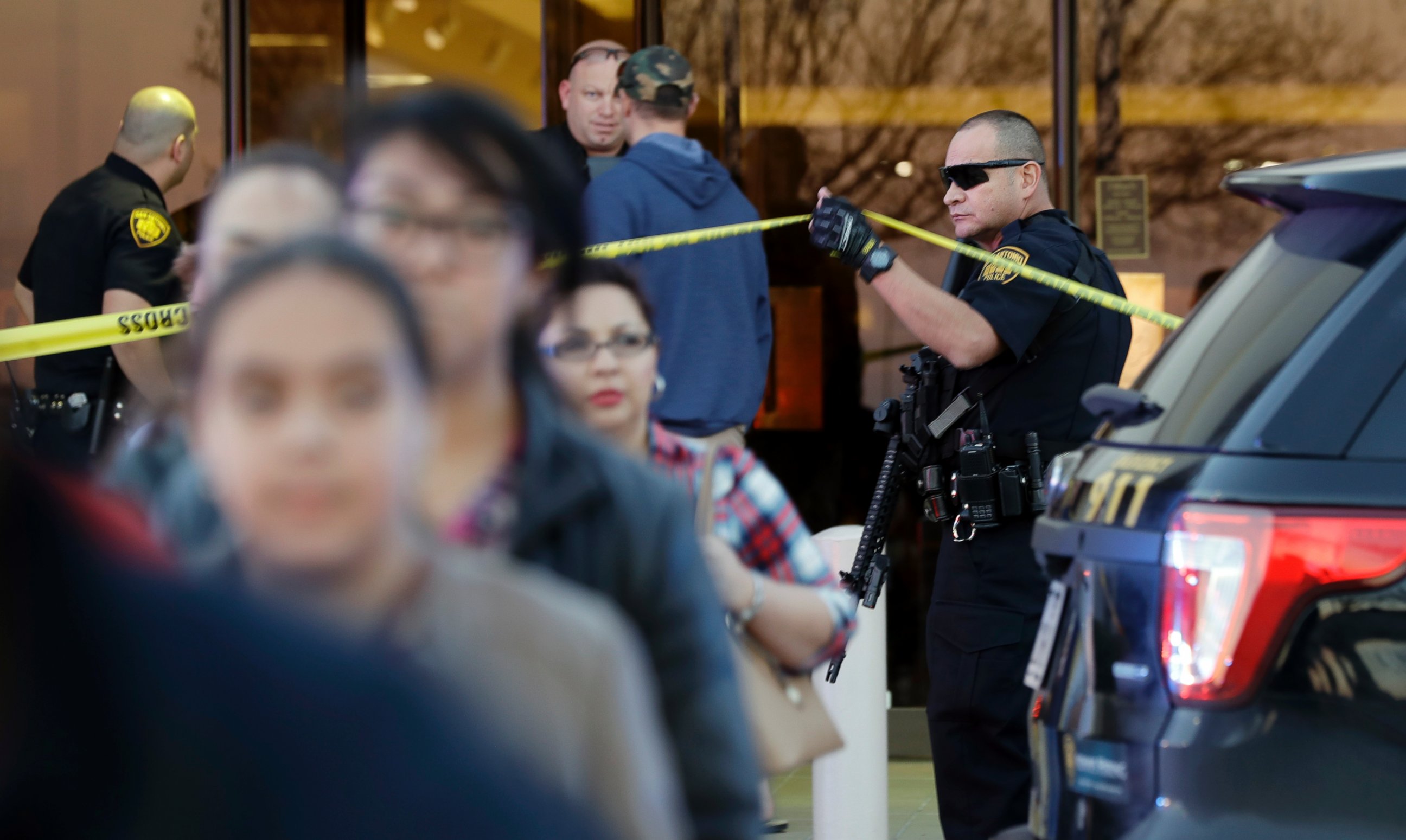 PHOTO: San Antonio police help shoppers exit the Rolling Oaks Mall after a deadly shooting, Jan. 22, 2017, in San Antonio, Texas. 