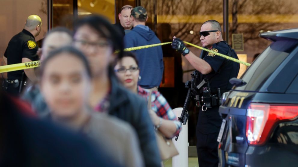 PHOTO: San Antonio police help shoppers exit the Rolling Oaks Mall after a deadly shooting, Jan. 22, 2017, in San Antonio, Texas. 