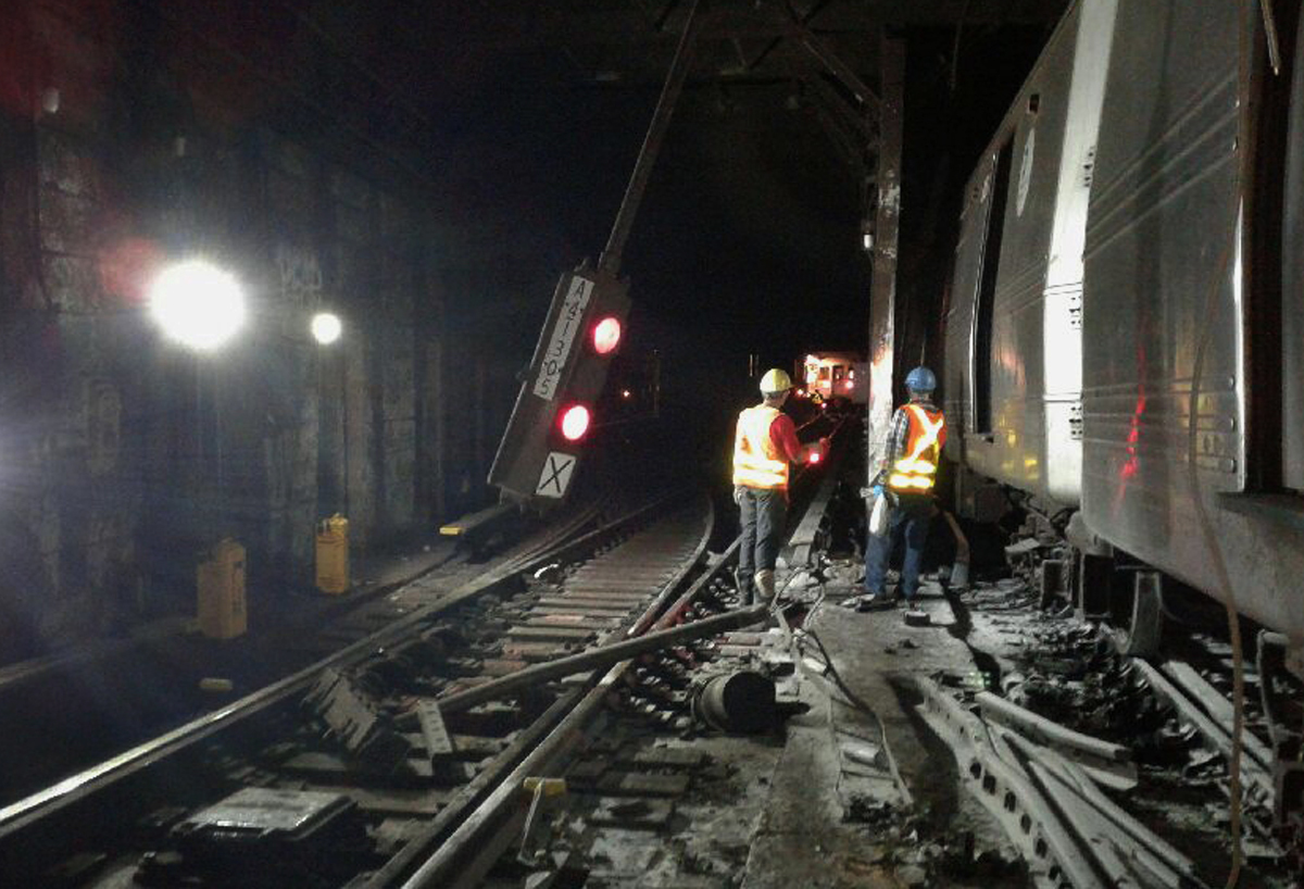 PHOTO: In this photo provided by the Transport Workers Union, Local 100, workers from the New York Metropolitan Transportation Authority respond to the scene of a subway derailment, June 27, 2017, in New York City. 