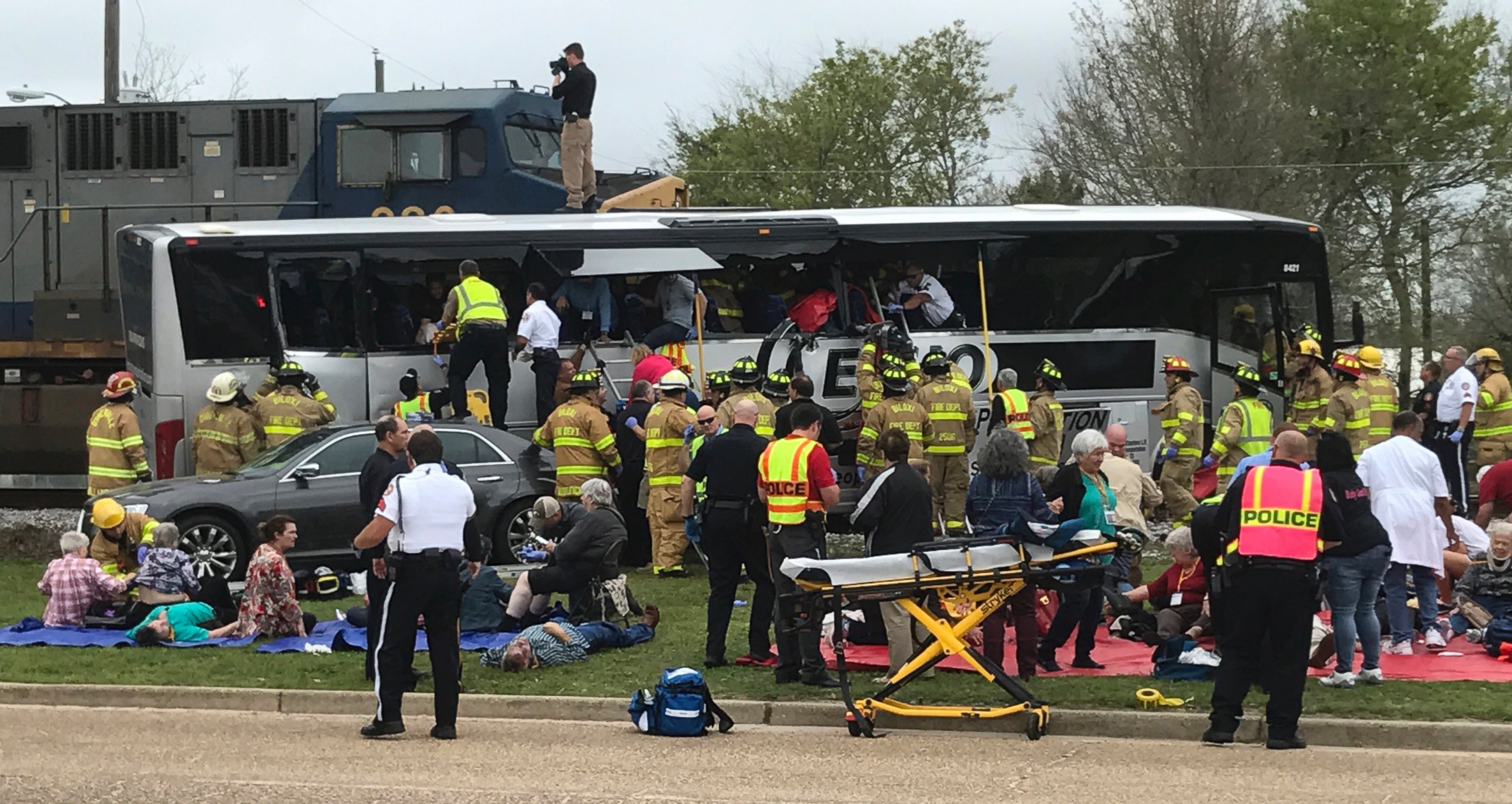 PHOTO: Biloxi, Miss., firefighters help passengers of a charter bus out of the damaged vehicle after the bus collided with a train, March 7, 2017. At least 3 people are dead .