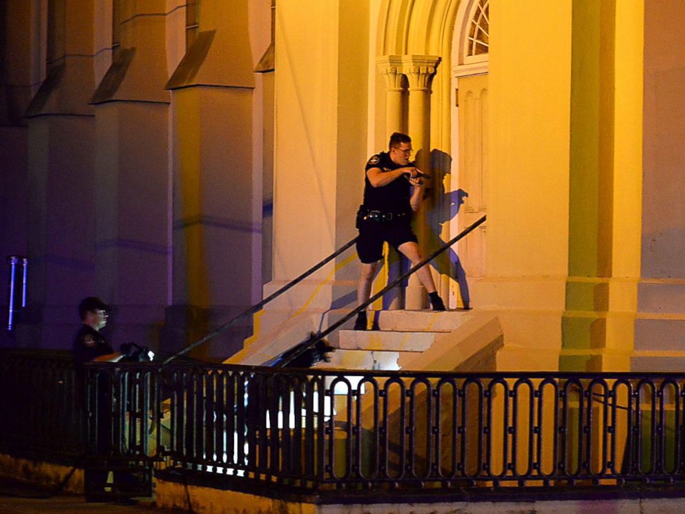 PHOTO: Charleston police officers search for a shooting suspect outside the Emanuel AME Church, in downtown Charleston, South Carolina, June 17, 2015.