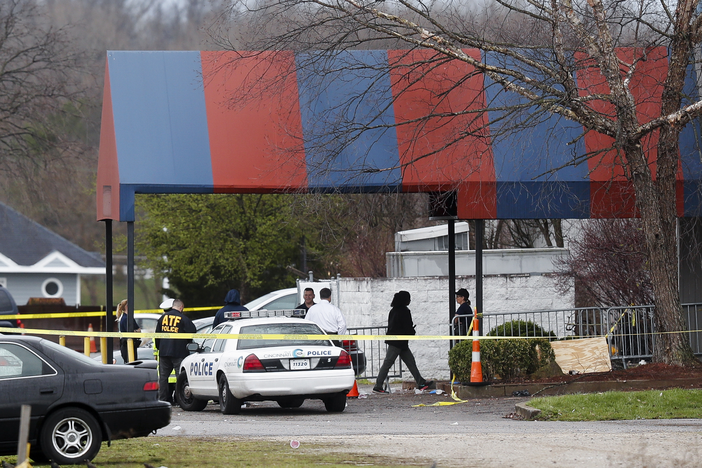 PHOTO: Members of the ATF and local police work at a crime scene at the Cameo club after a fatal shooting, March 26, 2017, in Cincinnati.