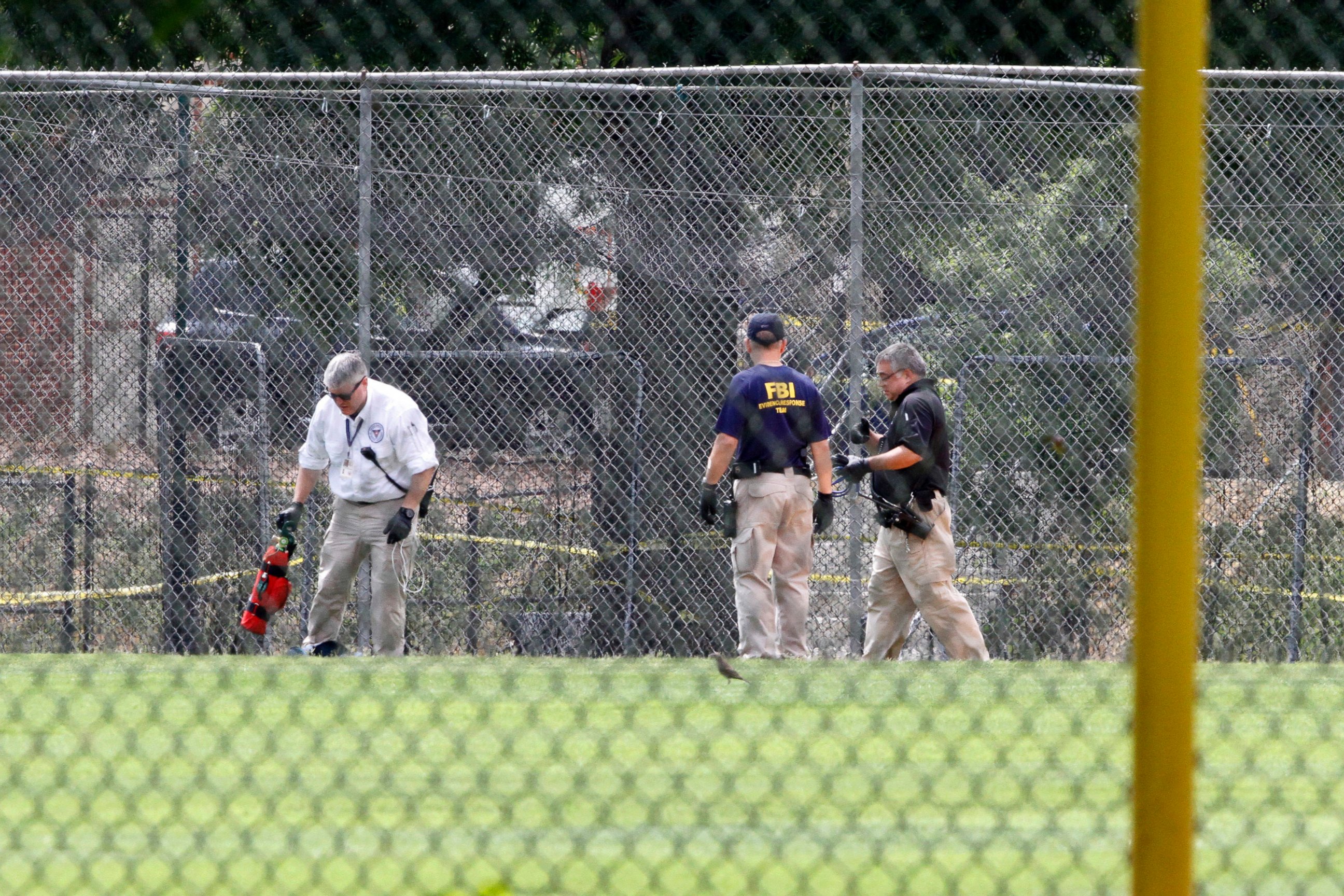PHOTO: FBI agents continue to search for evidence on the baseball field in Alexandria, Va., June 15, 2017, the day after House Majority Whip Steve Scalise of La. was shot during during a congressional baseball practice.
