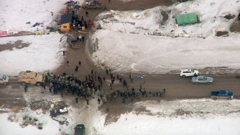 PHOTO: Law enforcement officers line up against protesters during the eviction of about 40 Dakota Access pipeline opponents from a camp on private property in southern North Dakota near Cannon Ball, North Dakota, Feb. 1, 2017.