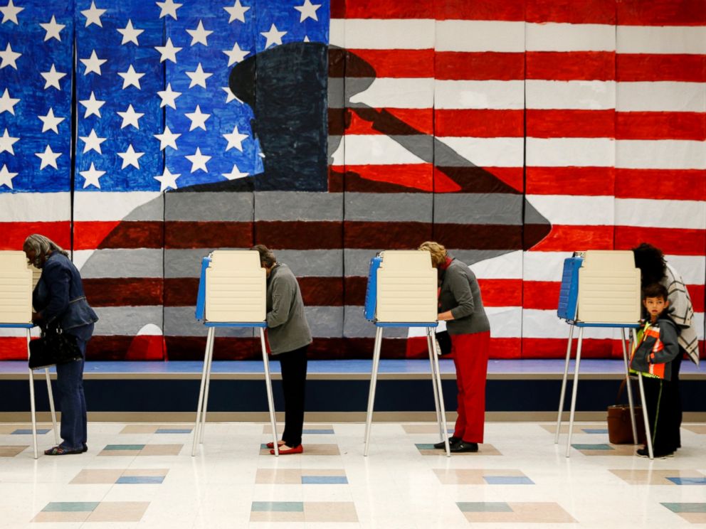 PHOTO: Voters line up in voting booths to cast their ballots at Robious Elementary School in Chesterfield, Virginia, Nov. 8, 2016.