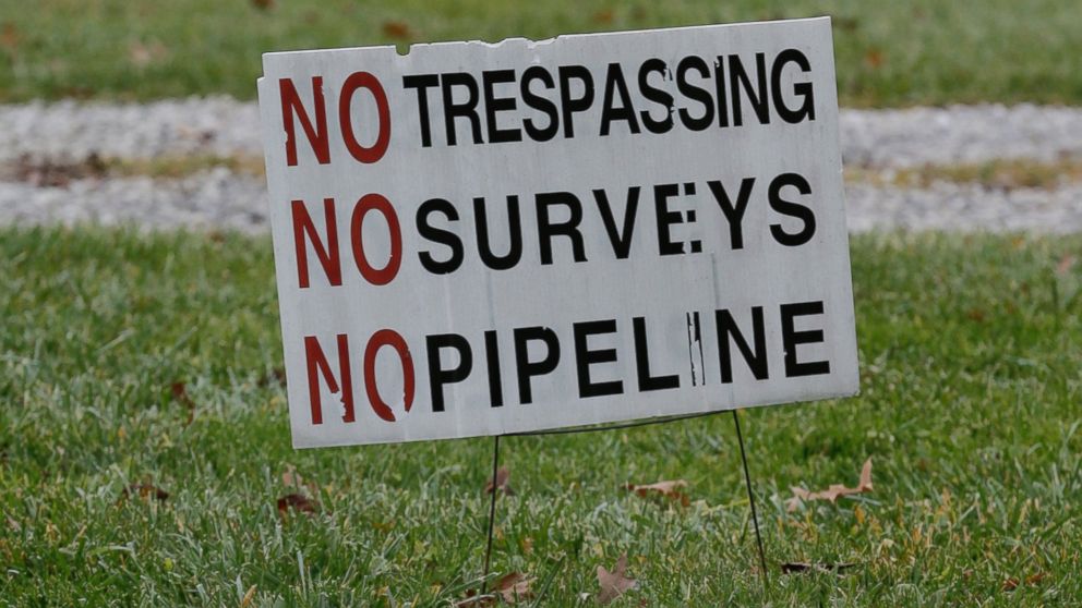Signs are posted on Jon Strong's property where a planned natural gas pipeline is scheduled to be built soon, Dec. 5, 2016, in Guilford Township near Wadsworth, Ohio. 