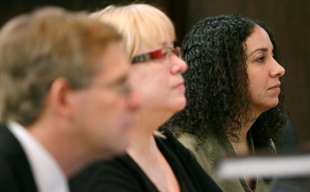 PHOTO: Hannah Overton, far right, sits next to her attorney, Cynthia Orr, center, and prosecutor, Doug Norman, April 26, 2012, in Corpus Christi, Texas.  