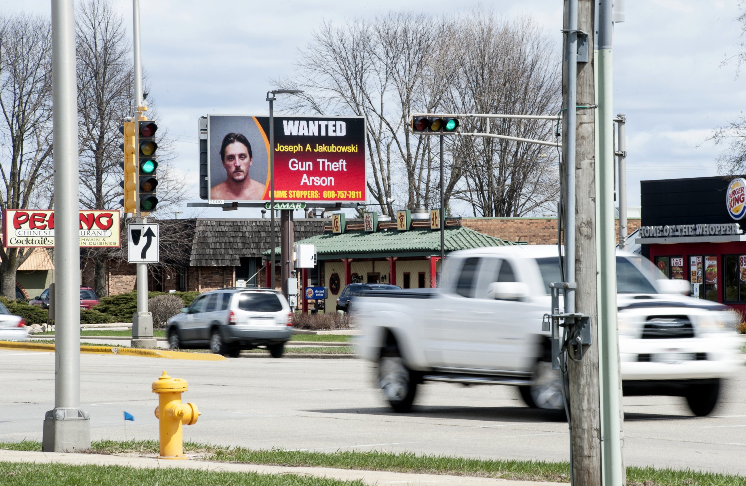 PHOTO: In this Thursday, April 6, 2017 photo, vehicles drive by an electronic billboard in Janesville, Wis., showing a wanted sign for Joseph Jakubowski.