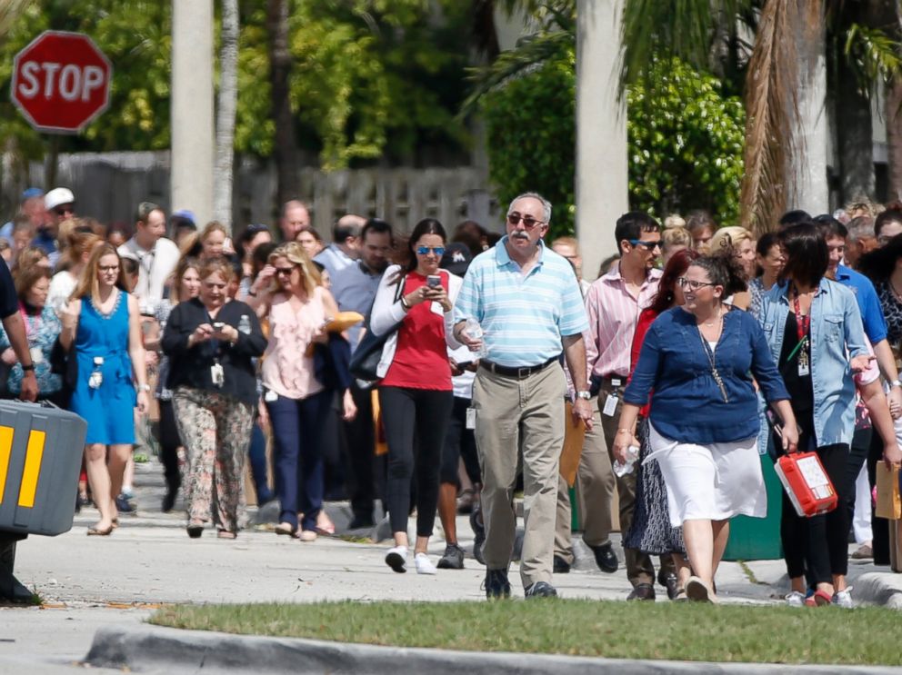 PHOTO: People evacuated because of a bomb threat return to the David Posnack Jewish Community Center and David Posnack Jewish Day School, Feb. 27, 2017, in Davie, Fla. 