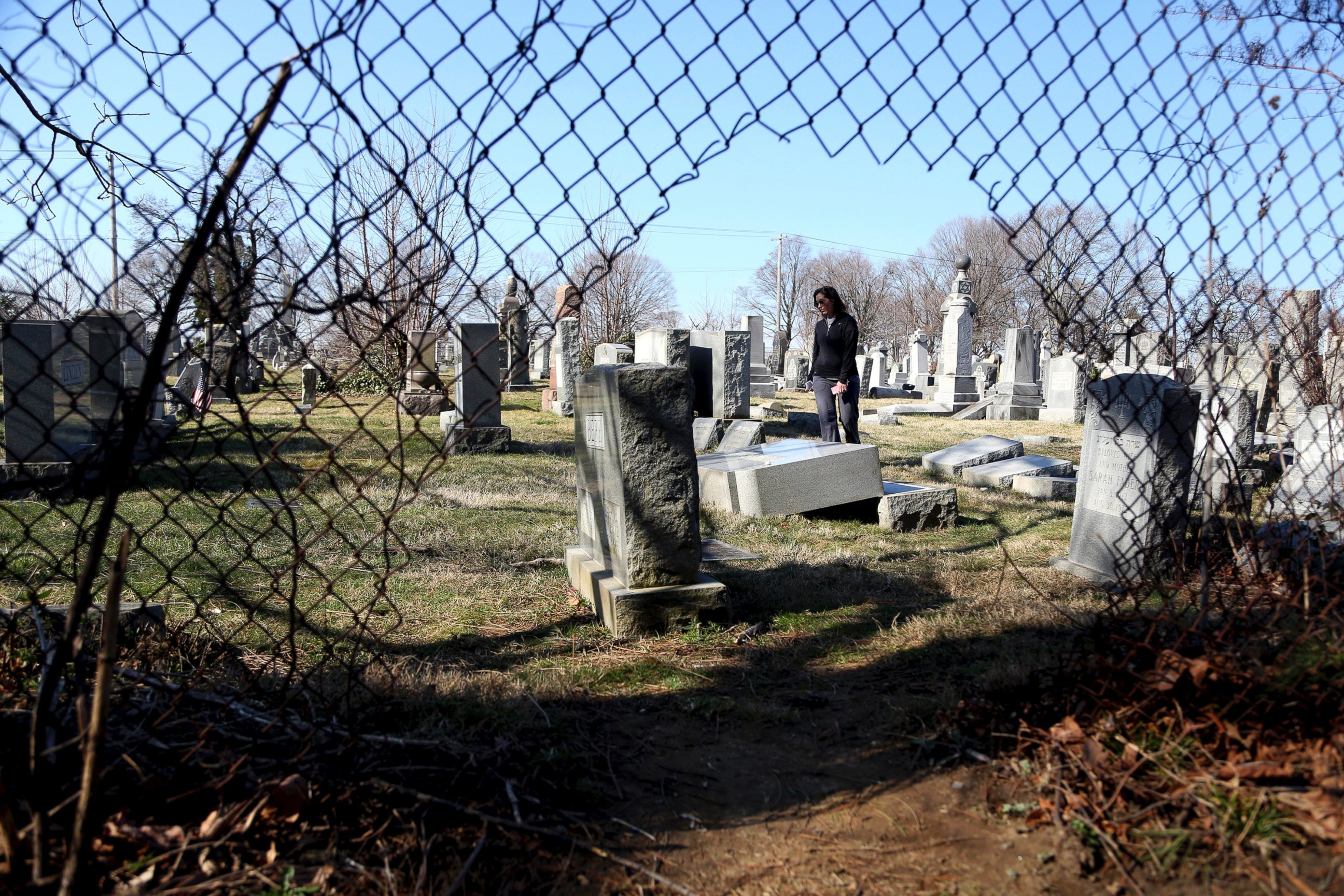 PHOTO: Stacy Biscardi searches the grounds of Mount Carmel Cemetery for a relative's grave in Philadelphia, Feb. 28, 2017. 