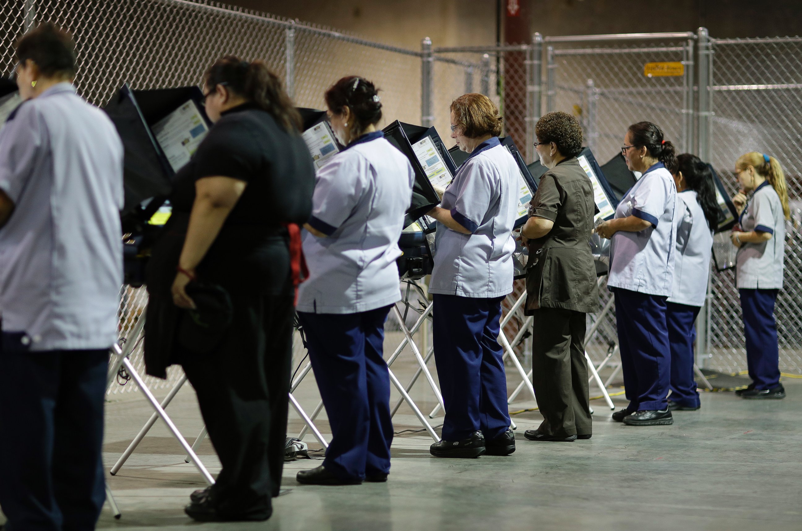PHOTO: Casino workers vote at an early voting site in Las Vegas, Oct. 26, 2016.