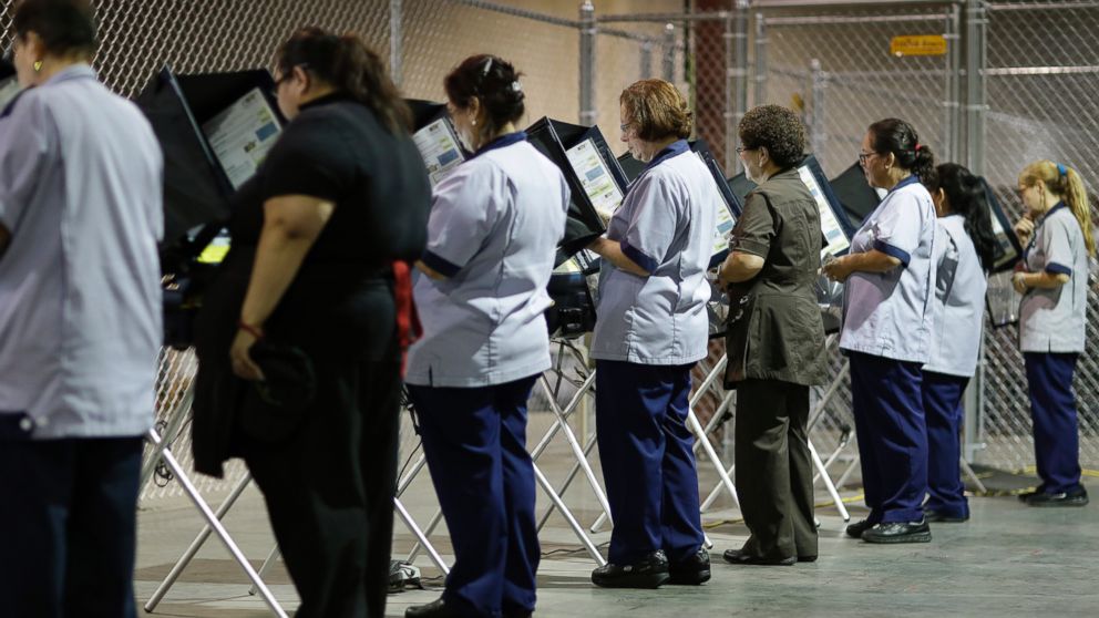 PHOTO: Casino workers vote at an early voting site in Las Vegas, Oct. 26, 2016.